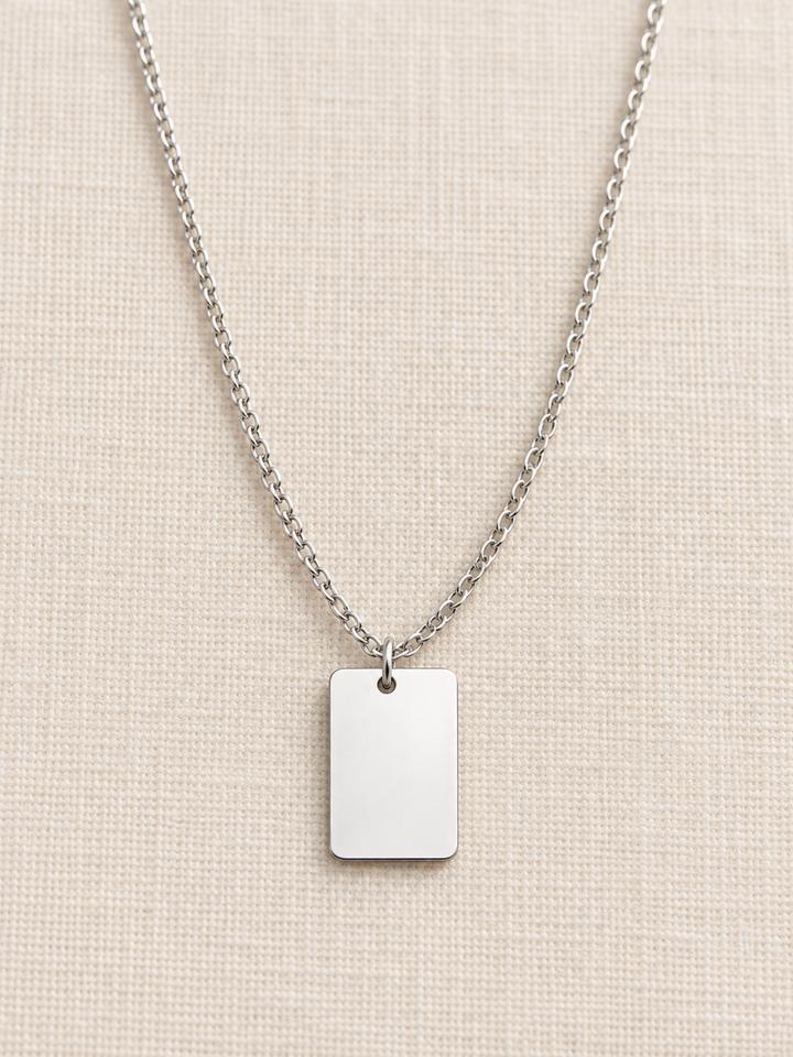 Placa rectangular pequeña de acero plateado con anilla, para grabar un nombre o una fecha